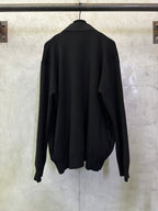 Black long coat back view with long sleeves and full length hem on a hanger