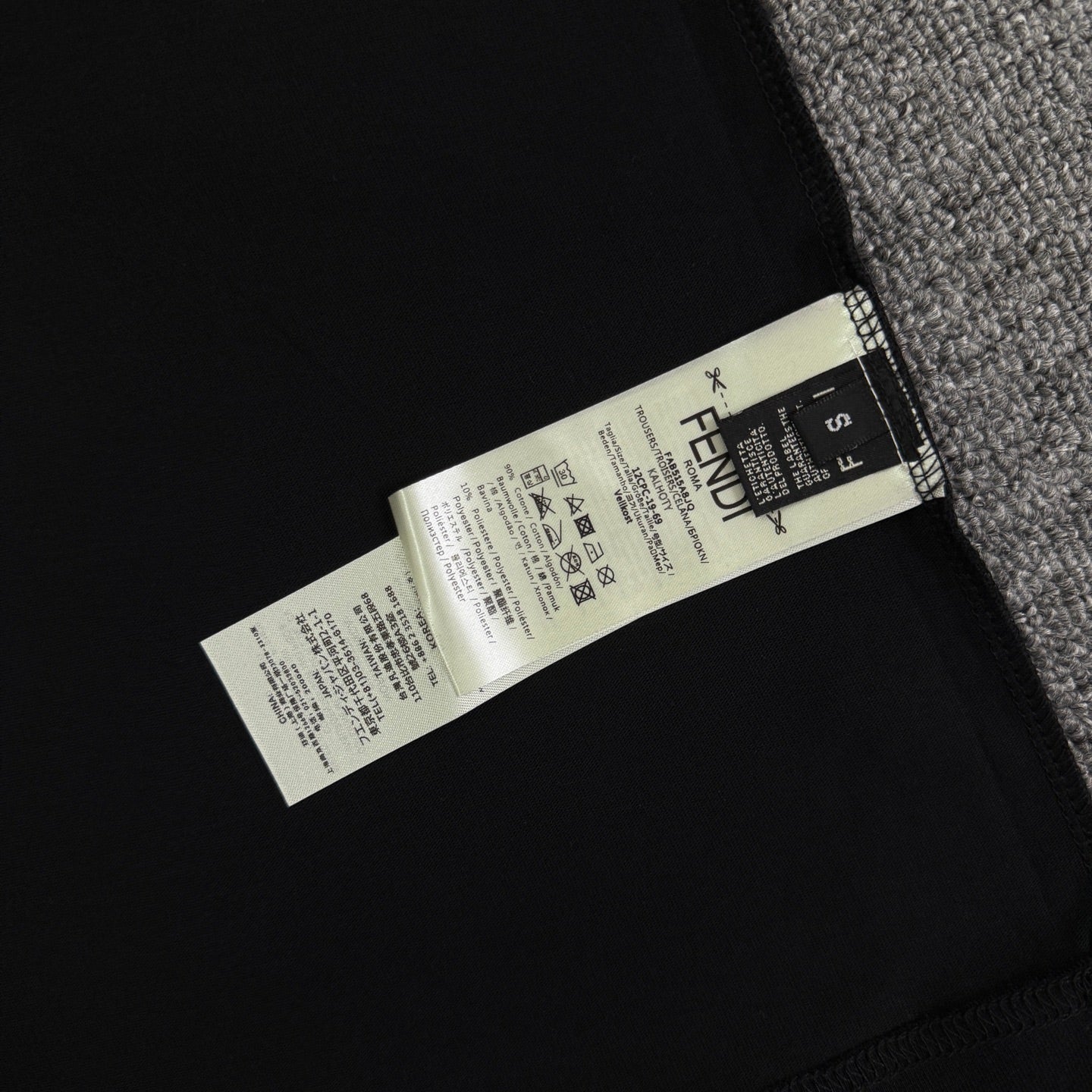 Fendi black T-shirt inside care label at side seam
