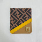 White Fendi T-shirt with brown-and-yellow logo patch at chest.