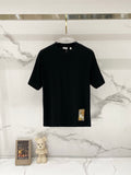 Burberry black short-sleeve T-shirt on a clear hanger, crew neck and straight hem.
