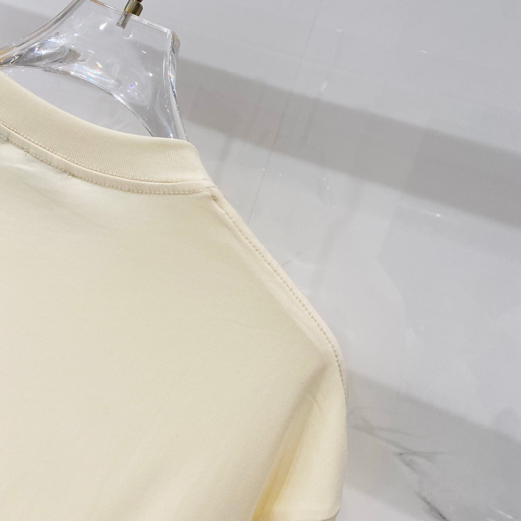 Pale yellow short-sleeve T-shirt with stitched sleeve hem and side seam