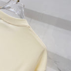 Pale yellow short-sleeve T-shirt with stitched sleeve hem and side seam