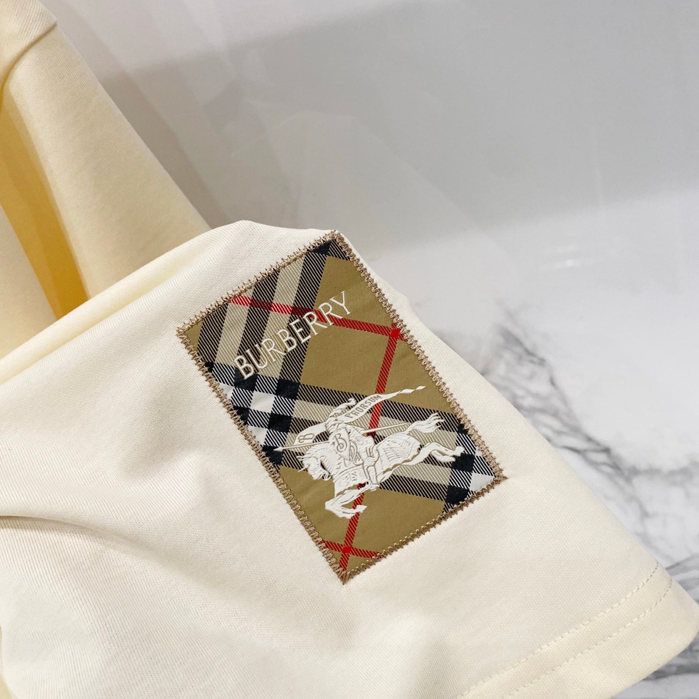 Pale yellow T-shirt with embroidered Burberry check patch and horse graphic