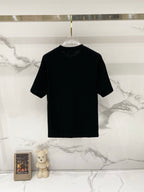 Burberry black short-sleeve T-shirt on a clear hanger, crew neck and plain back.