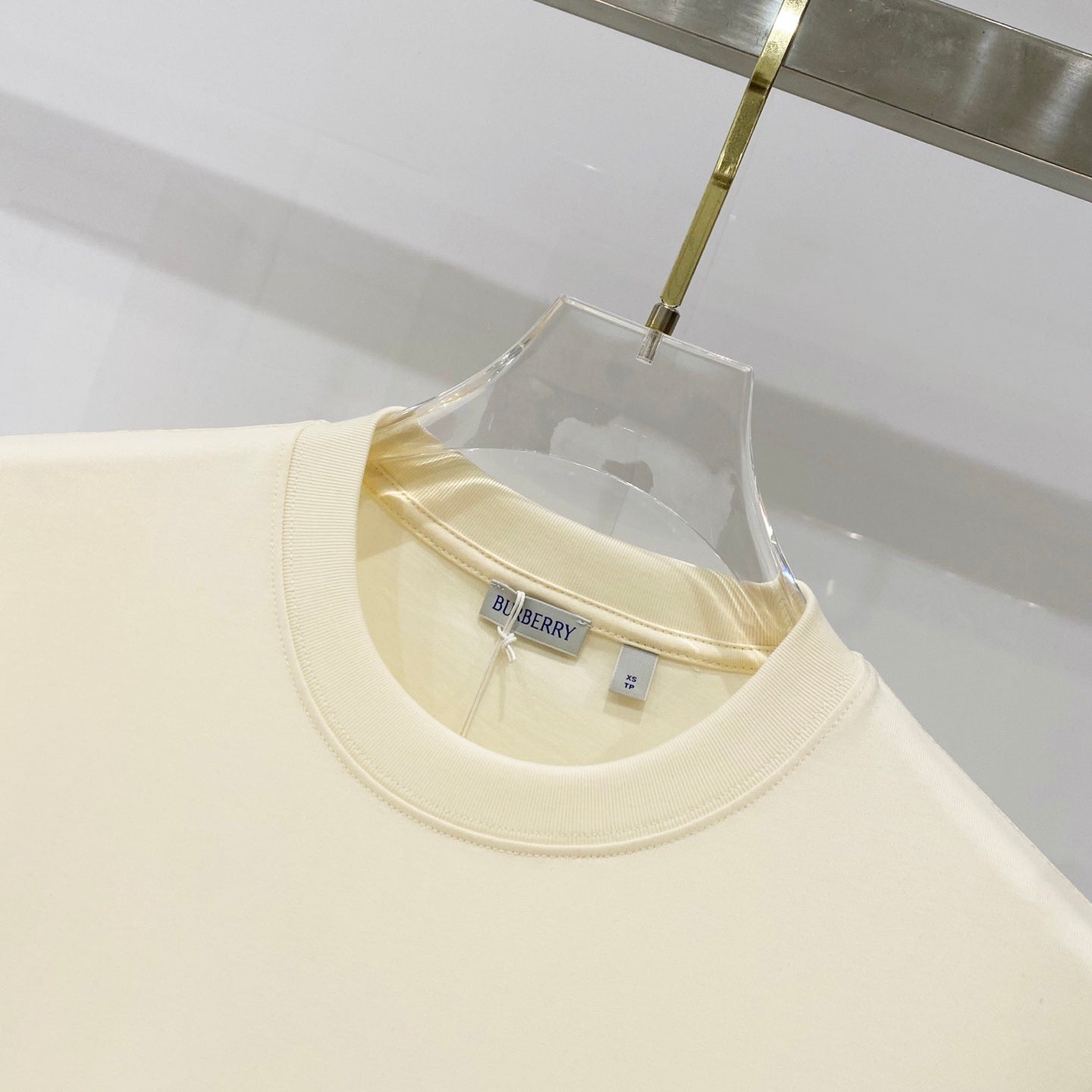 Pale yellow short-sleeve T-shirt neckline with inner Burberry label