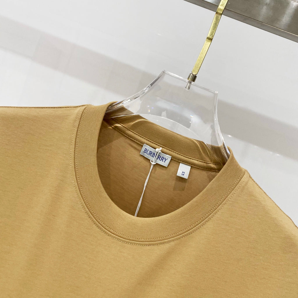 Tan crew-neck short-sleeve T-shirt neckline with inner label