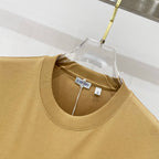 Tan crew-neck short-sleeve T-shirt neckline with inner label