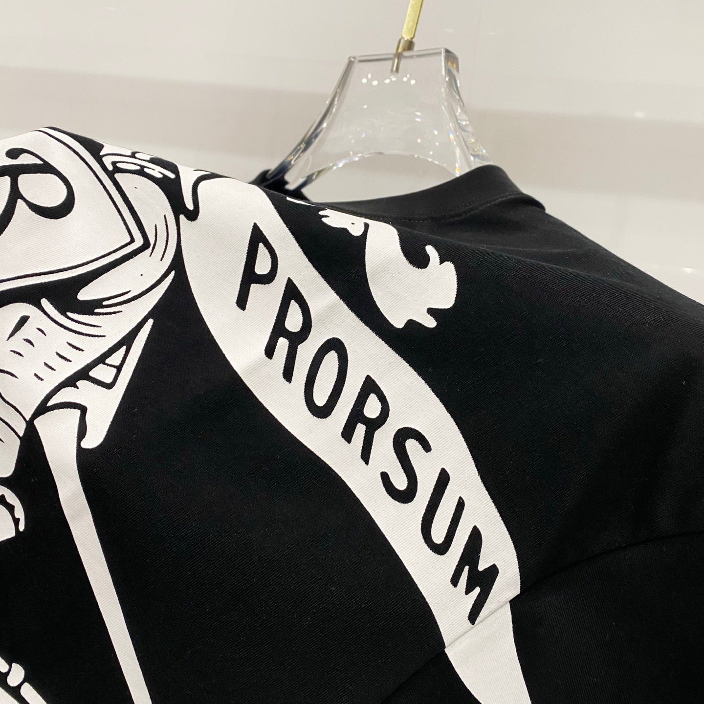 Black T-shirt with white diagonal 'PRORSUM' graphic print