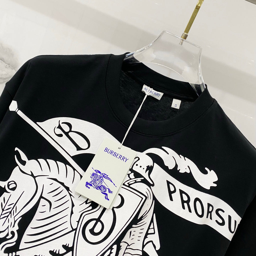Black T-shirt with white horse-and-rider graphic and blue logo detail