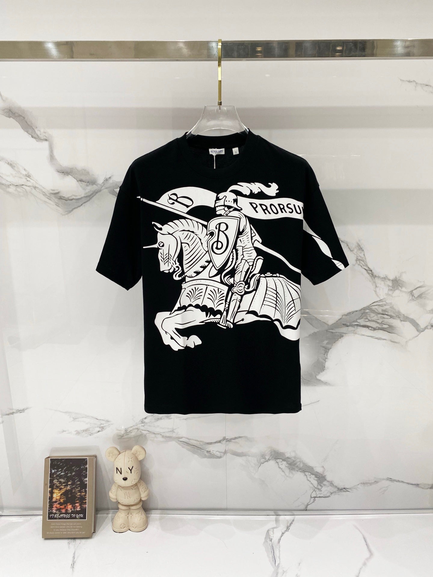 Black short-sleeve T-shirt with large white graphic print and crew neckline