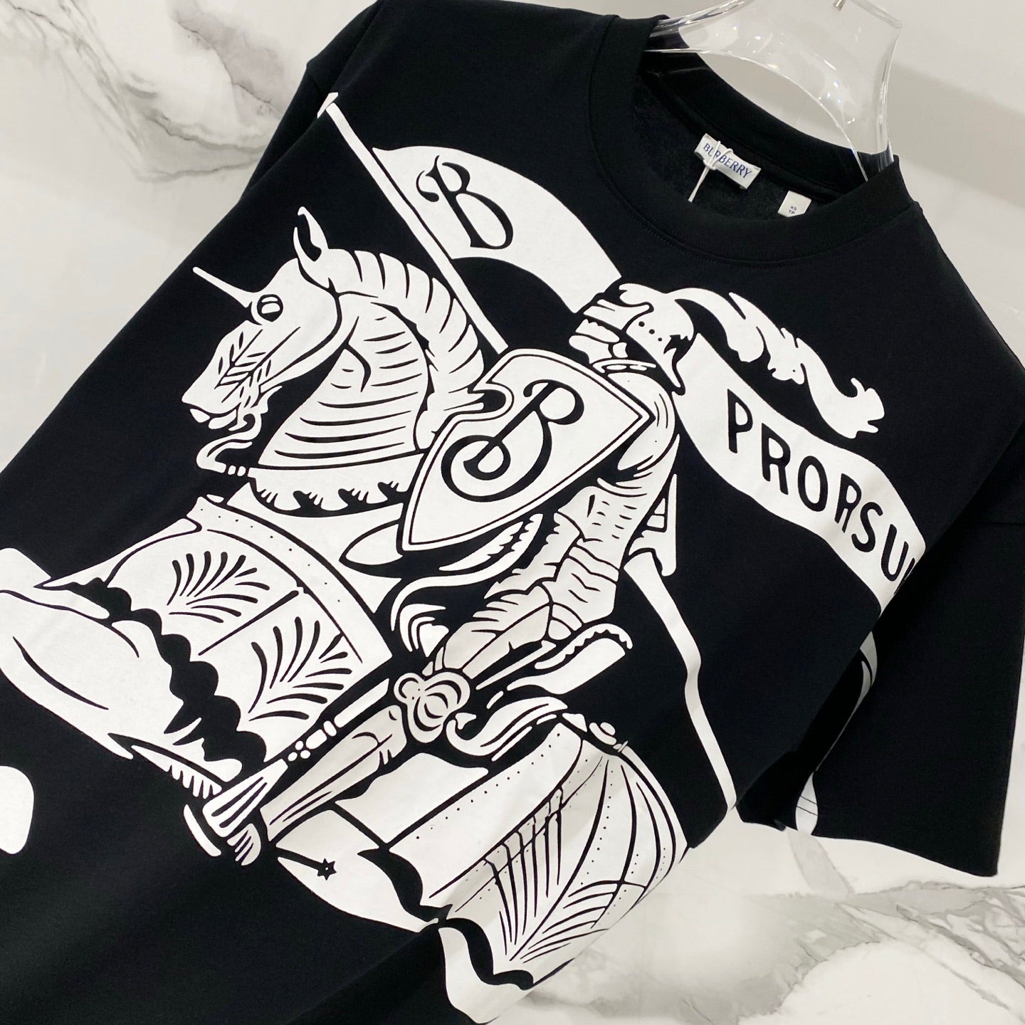Black T-shirt with white horse-and-rider graphic panel and crew neckline