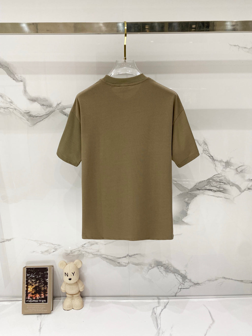 Burberry beige graphic T-shirt, plain back view on hanger