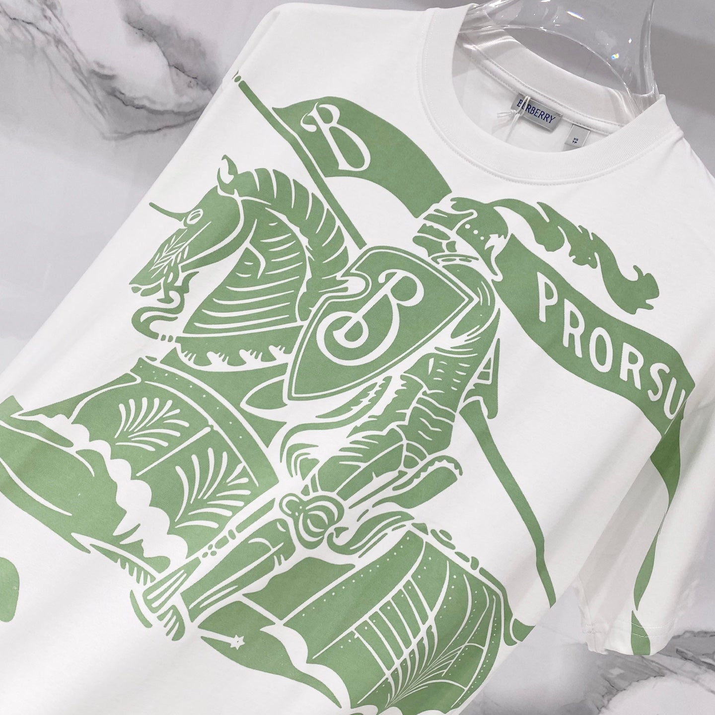Kids white T-shirt close-up with large green animal graphic and PROSU lettering
