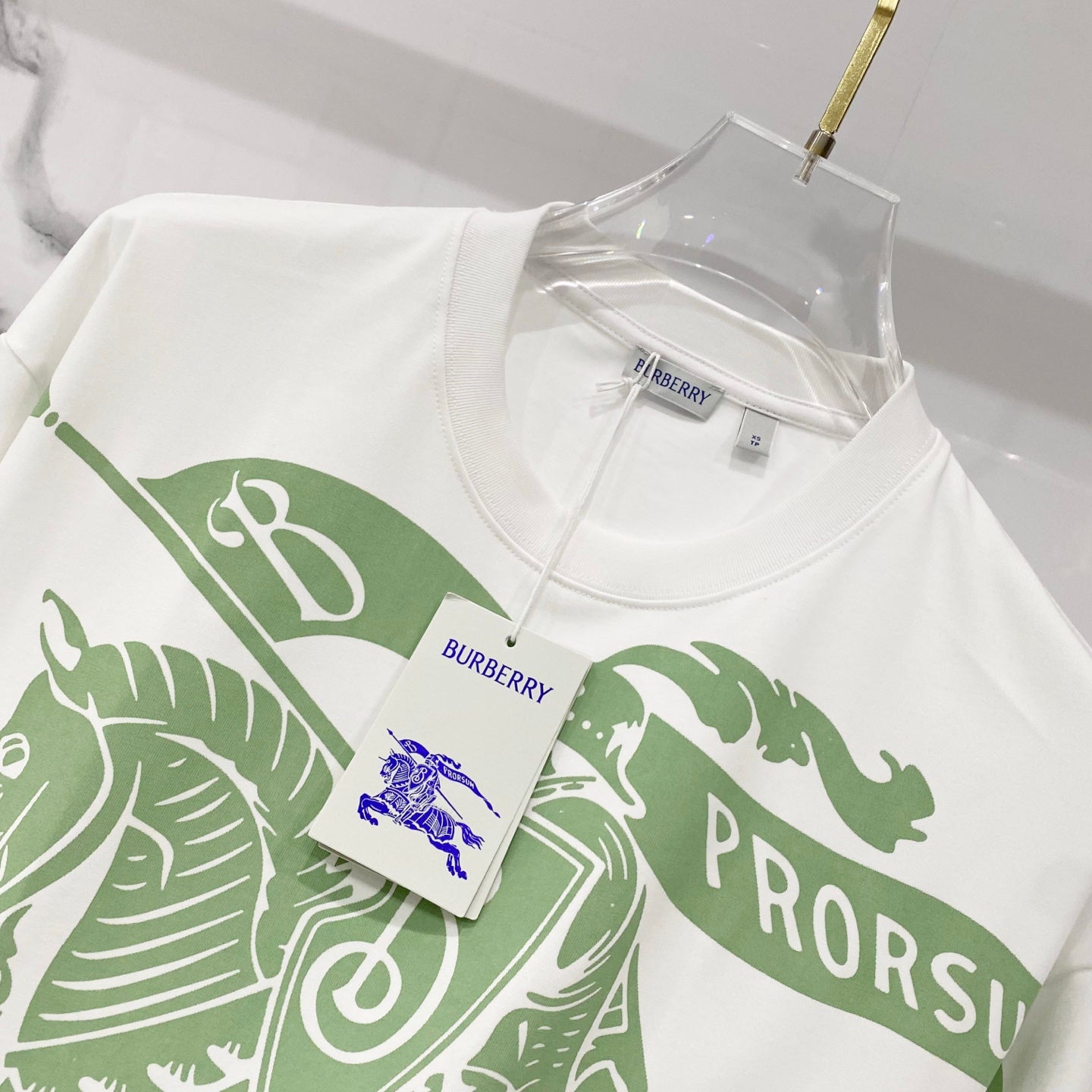 Kids white T-shirt with green animal stripe graphic and hanging price tag