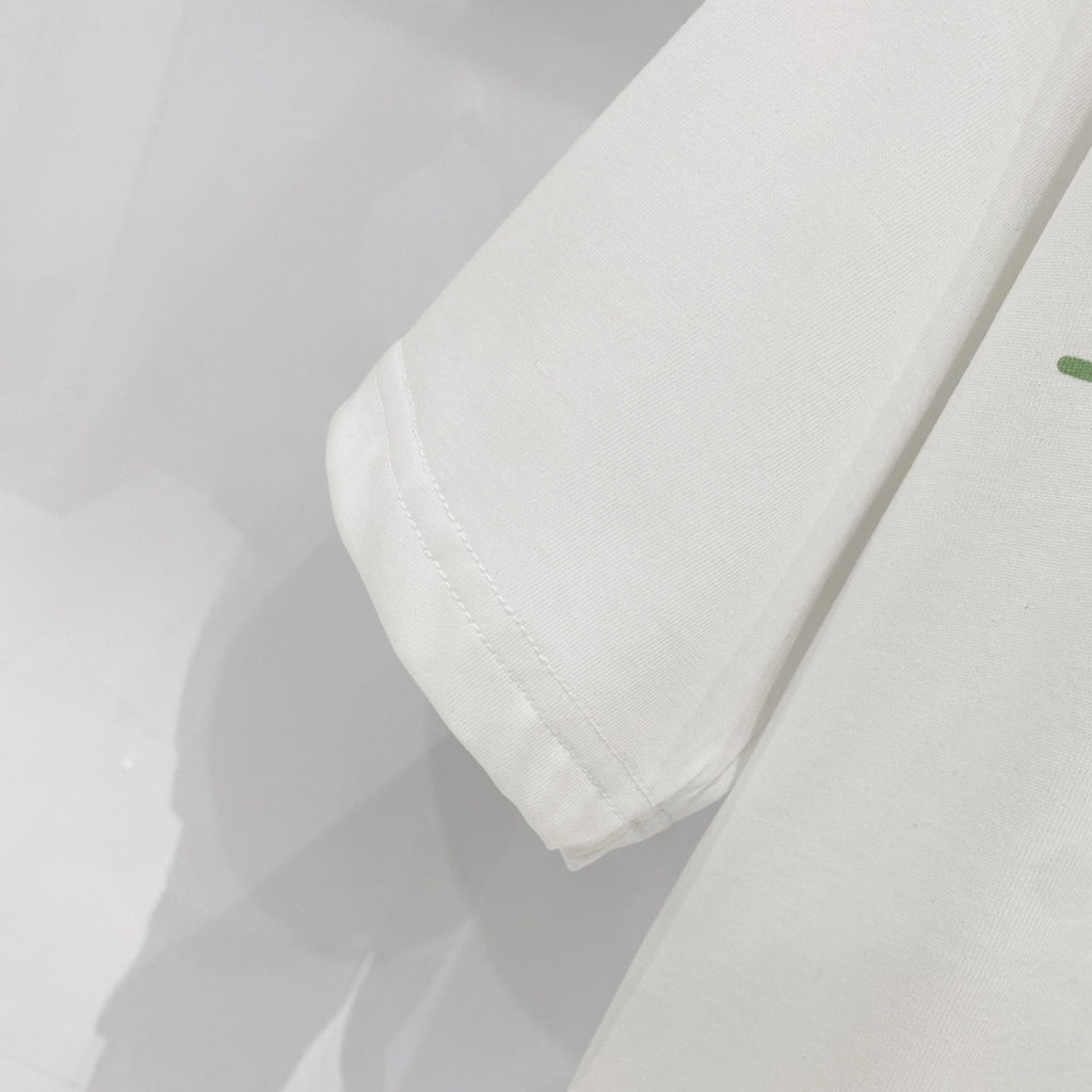Kids white T-shirt close-up of hem with visible stitching