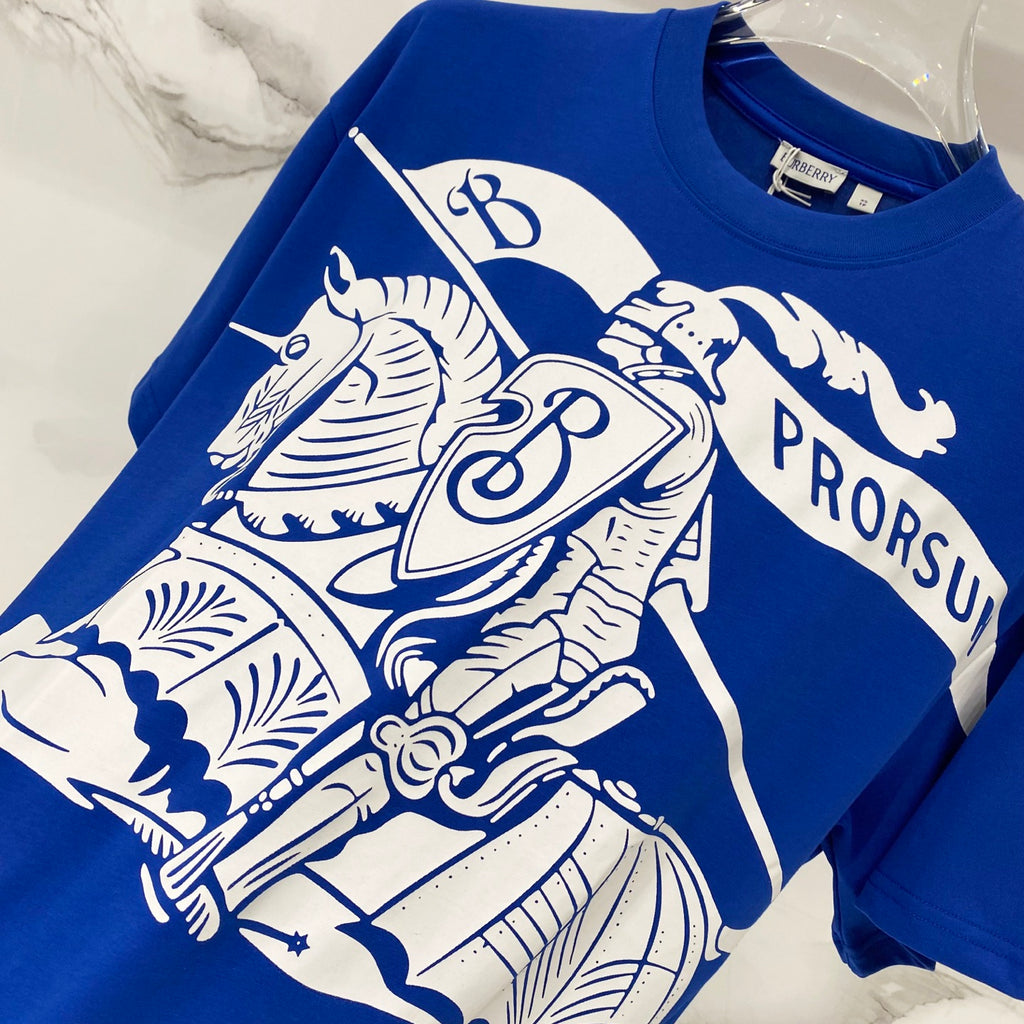 Blue short-sleeve T-shirt with ornate white animal and crest graphic print