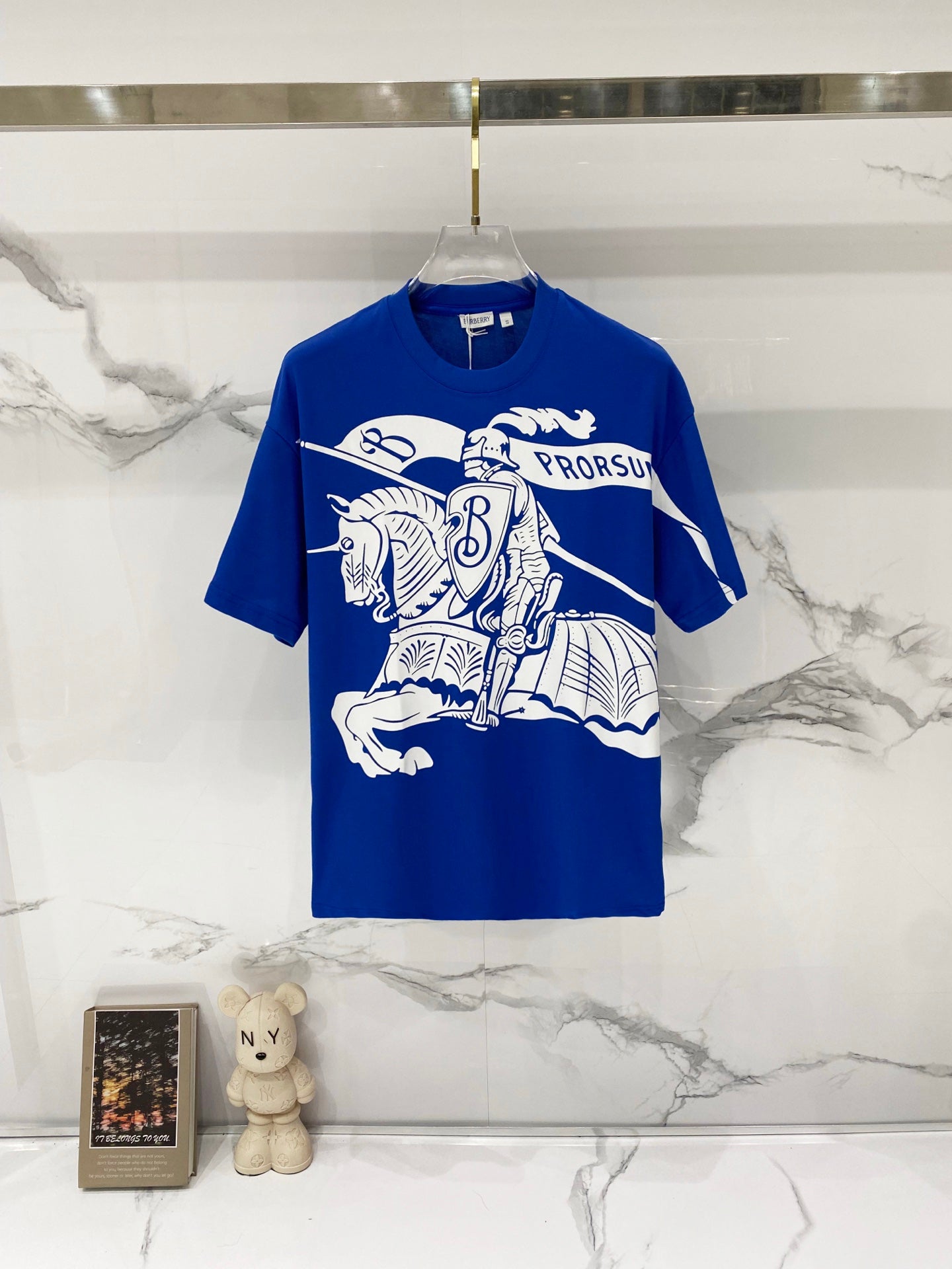 Blue short-sleeve T-shirt with large white logo graphic and crew neck