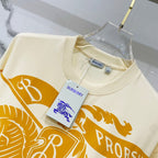 Burberry short-sleeve T-shirt with cream base, orange graphic and small hang tag