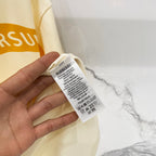 Burberry short-sleeve T-shirt care label on cream fabric