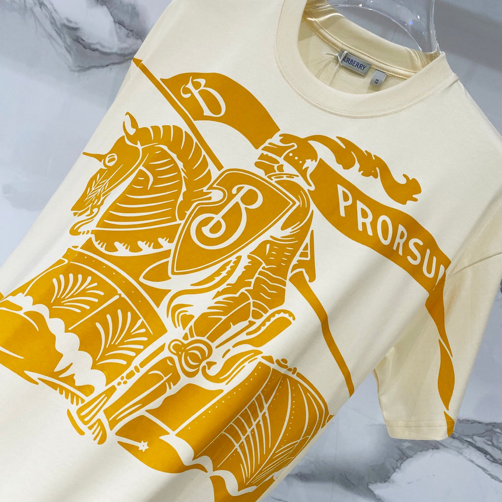 Burberry short-sleeve T-shirt, cream with orange rider and “PRORSUM” graphic