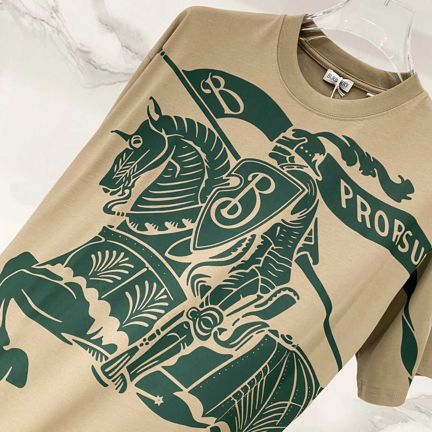 Burberry beige T-shirt with large green horse rider graphic and 'PRO...' text