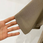 Burberry beige T-shirt sleeve cuff close-up with visible stitching