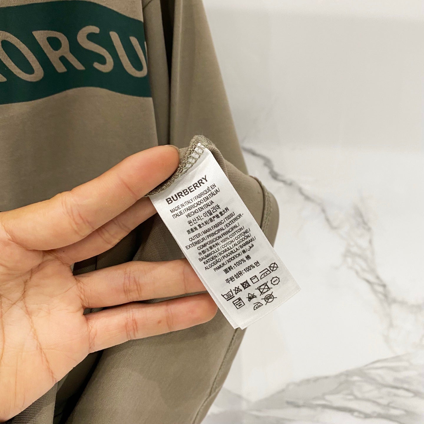 Burberry beige T-shirt care and size label on inner seam