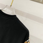 Black T-shirt shoulder and neckline with check sleeve panel