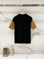 Black short-sleeve T-shirt on hanger with check-pattern sleeves