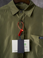 Olive Prada button-up shirt collar close-up with hanging size tags