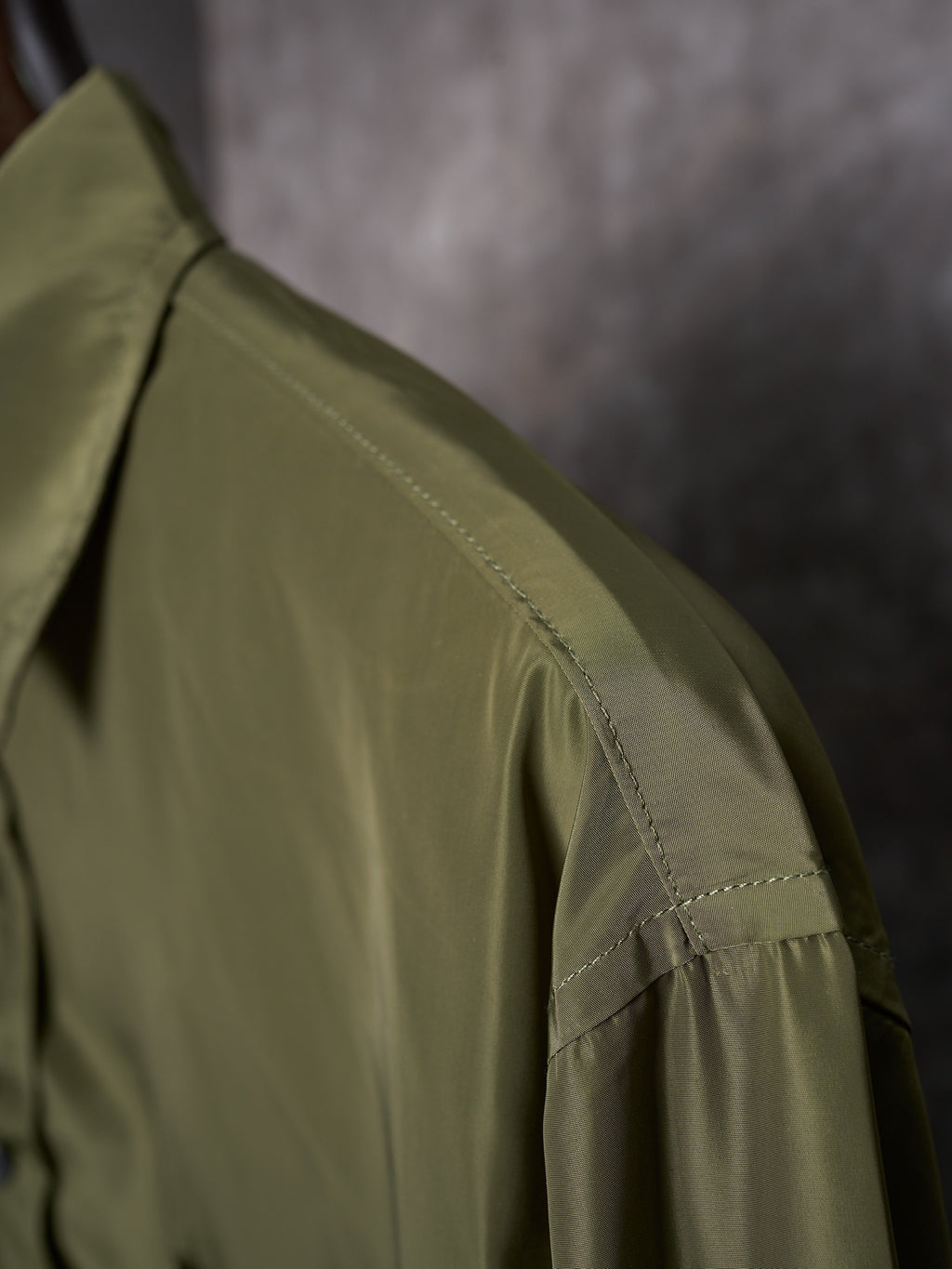 Olive Prada button-up shirt sleeve and shoulder seam detail
