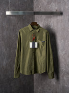 Olive Prada button-up shirt with pointed collar, button placket, and hanging tag