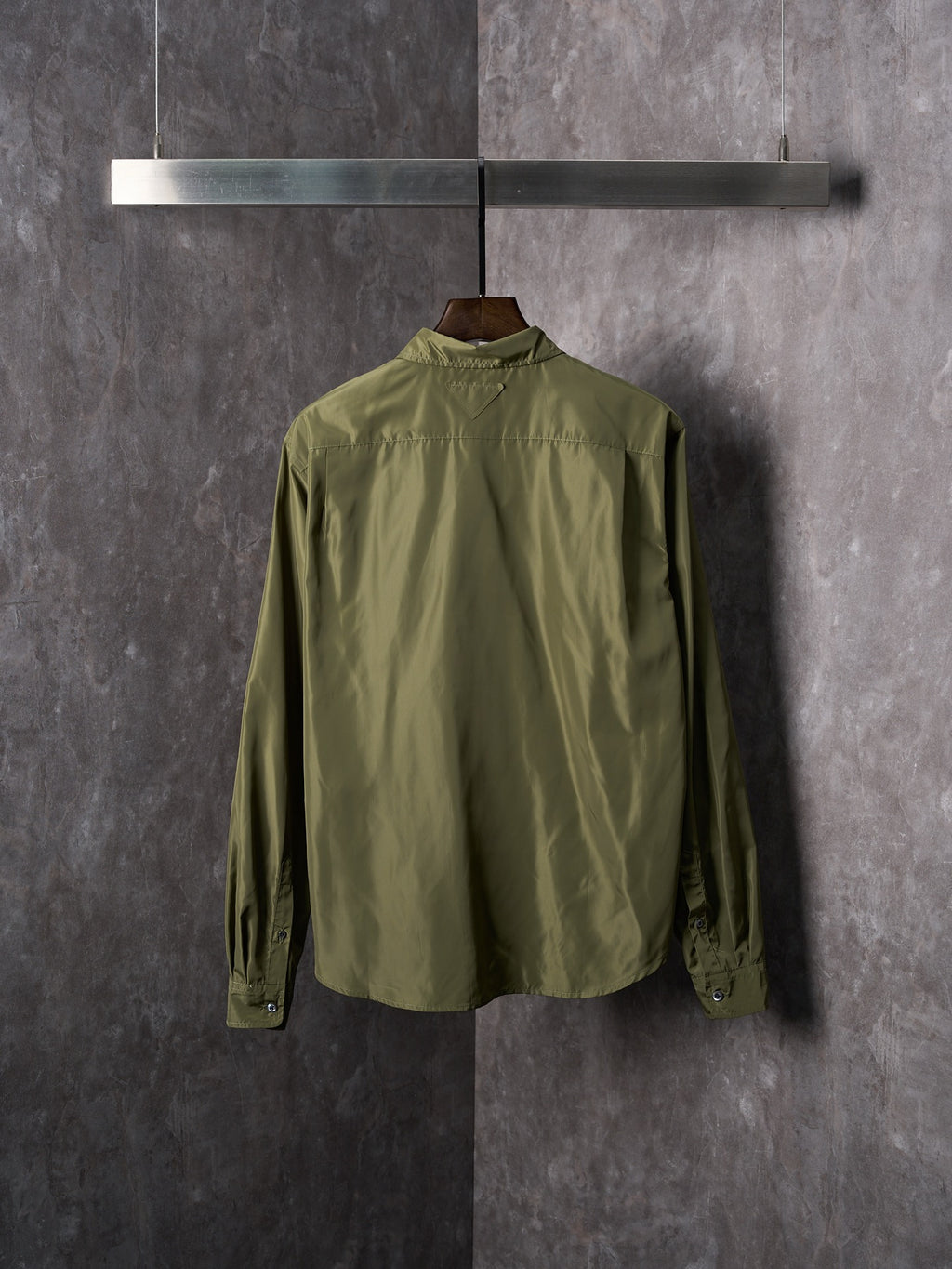 Olive Prada button-up shirt back view with yoke and buttoned cuffs