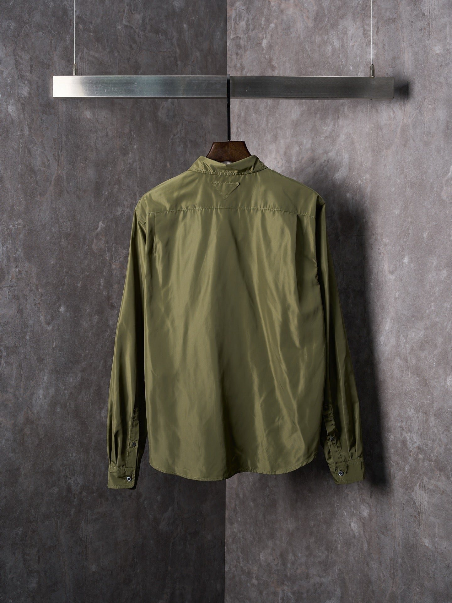 Olive Prada button-up shirt back view with yoke and buttoned cuffs