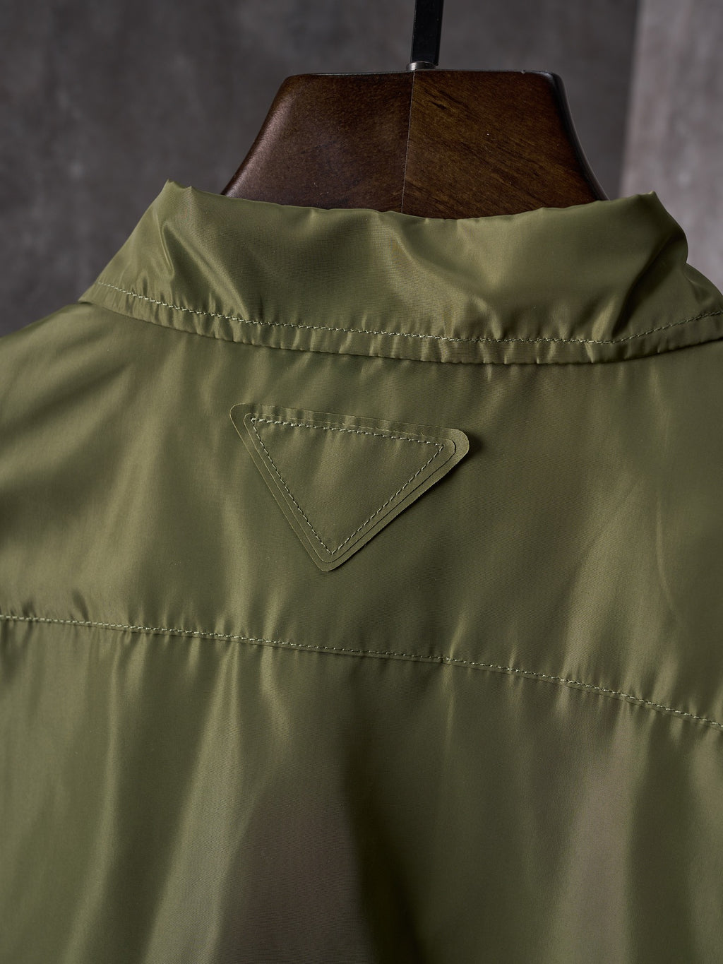 Olive Prada button-up shirt back yoke with triangular logo panel
