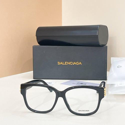 Balenciaga eyeglasses, dark navy rectangular frame, gold logo temple tips