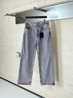 Light blue denim pants on hanger with front button and two front pockets