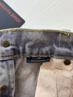 Denim pants waistband with Louis Vuitton label, buttoned fly and gold topstitching