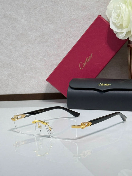Gold eyeglasses with clear lenses and dark temples, angled view