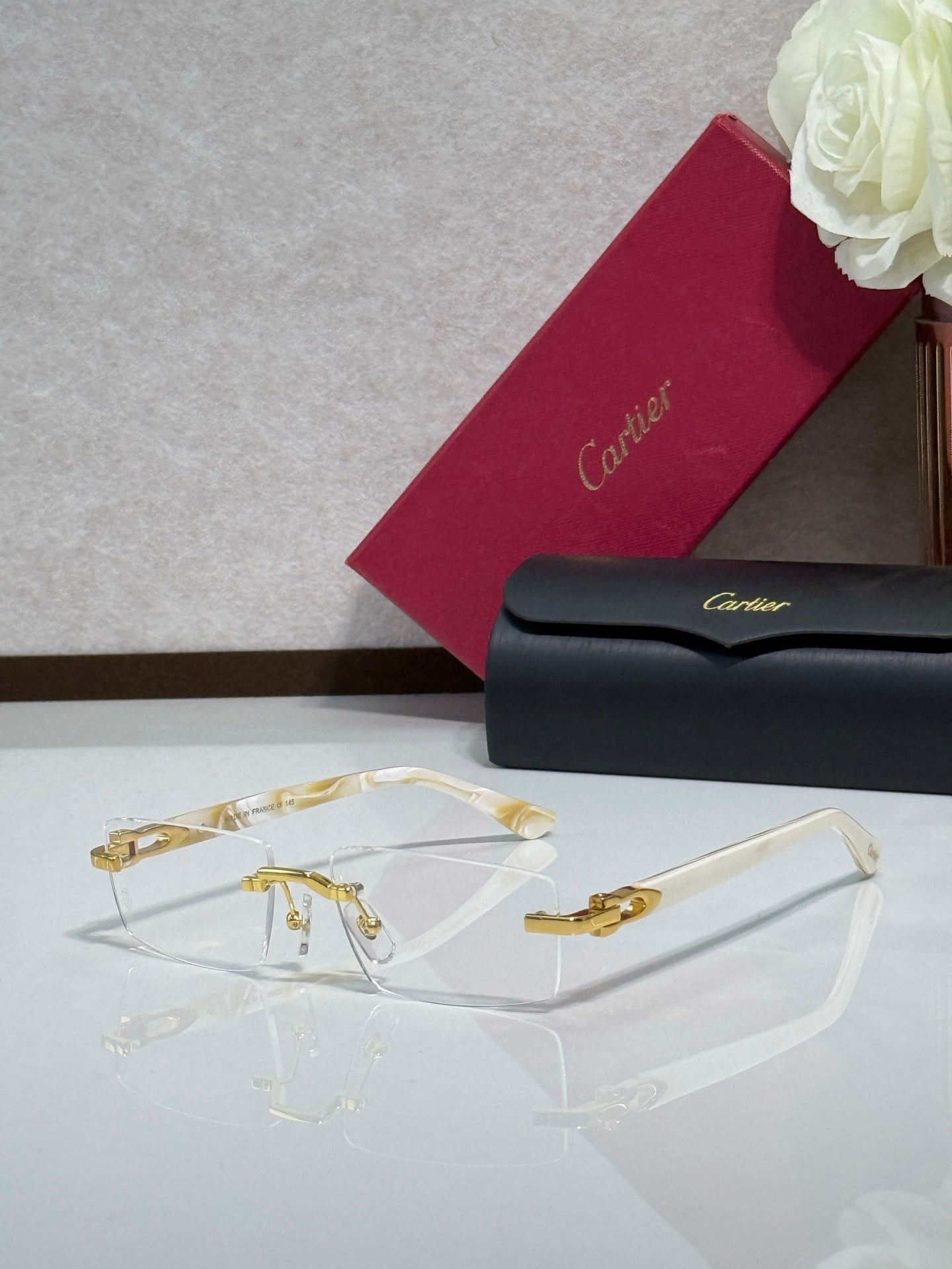 Gold and clear eyeglasses with tortoise temples and clear lenses