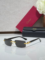 Cartier eyeglasses with dark rectangular frames, gold-tone hinges, and temple tips