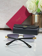 Cartier eyeglasses with purple-tinted lenses, gold-tone frame, and black temples