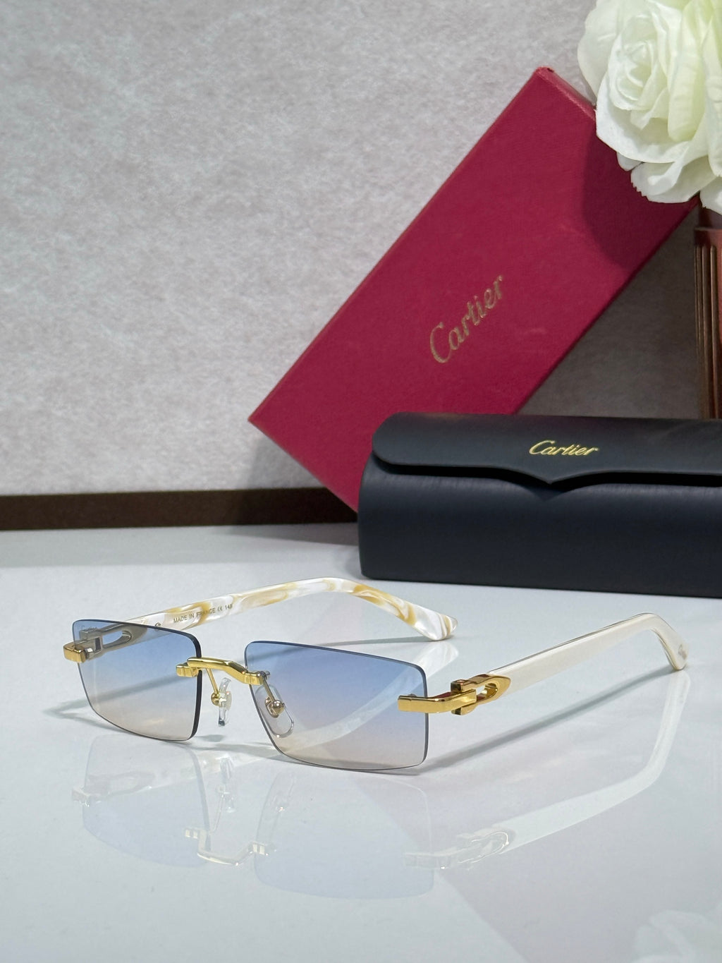 Cartier eyeglasses with gold-tone frame, clear lenses, and small decorative details