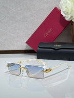 Cartier eyeglasses with gold-tone frame, clear lenses, and small decorative details