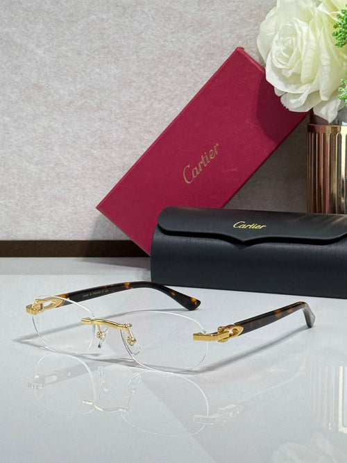 Cartier eyeglasses with clear lenses, gold frame accents, and dark temples