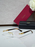 Cartier glasses with tortoiseshell temples, gold details, and clear lenses
