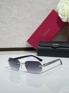 Cartier glasses with dark tinted lenses and black frame with gold accents