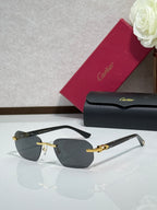 Cartier glasses with black frame, gold details, and dark tinted lenses