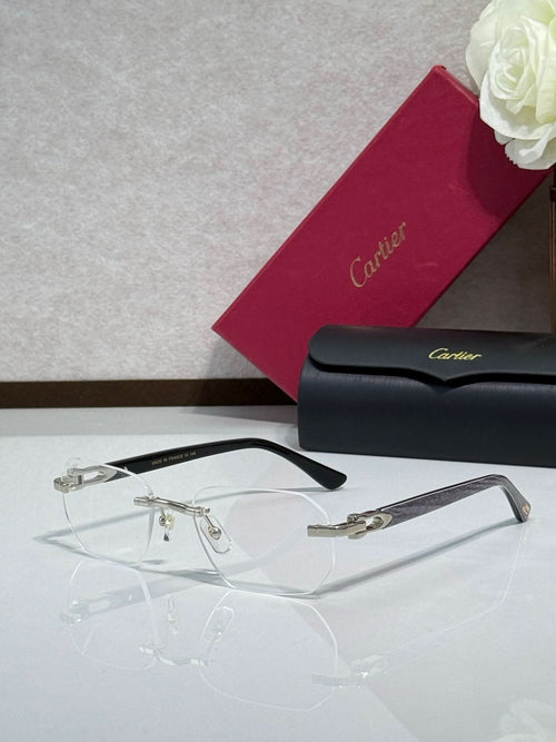 Cartier glasses with black frame, gold hinges, and clear eyeglass lenses