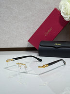 Cartier glasses with black frame, gold accents, and clear eyeglass lenses